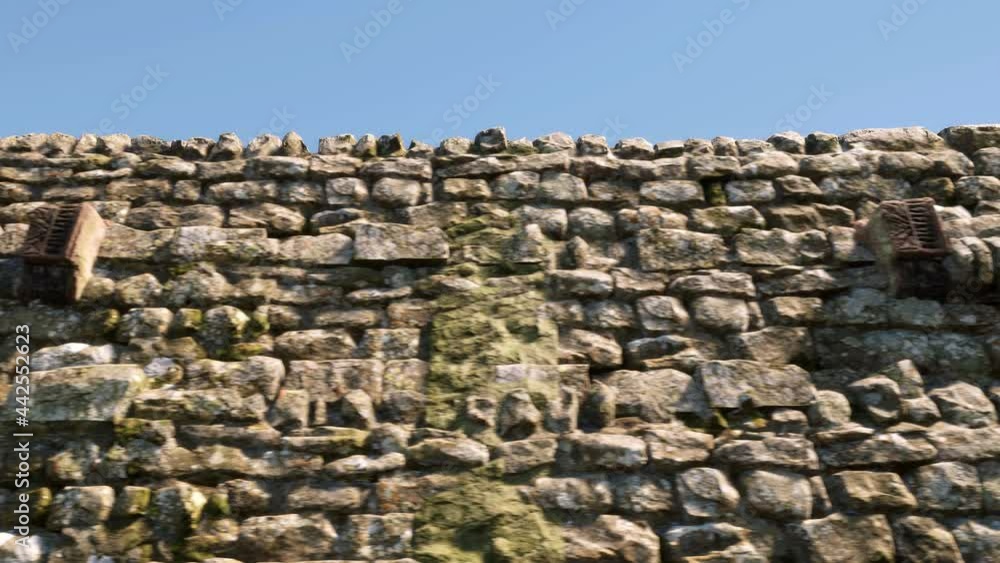 Multiple old and disused Gatling Guns rusting away at the top of an old fortified stone castle, where they once fired. Multiple old and disused Gatling Guns rusting away at the top of an old fortified stone castle, where they once fired.