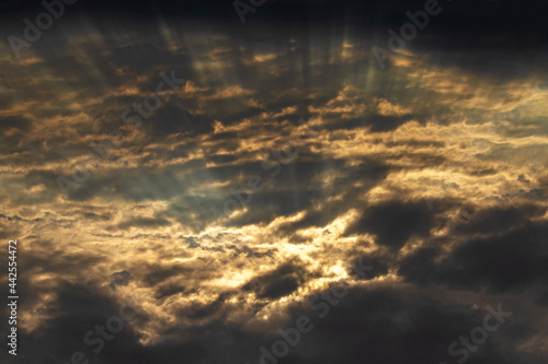 The sun's rays make their way through the clouds in cloudy weather.