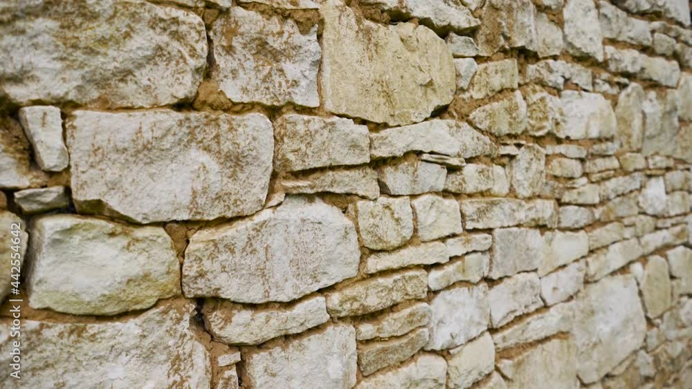 White stone masonry. Texture of a stone wall. Old castle stone wall texture background. Stone wall as a background or texture. White stone masonry. Texture of a stone wall. Old castle stone wall texture background. Stone wall as a background or texture.