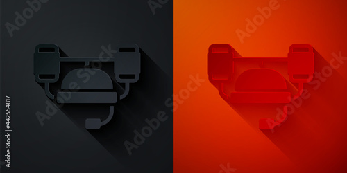 Paper cut Beer helmet or hand free for drink icon isolated on black and red background. Paper art style. Vector