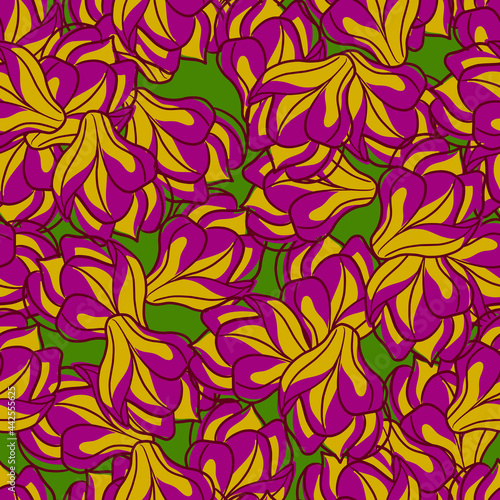 Bloom seamless pattern with yellow and purple colored magnolia flowers print. Green background.