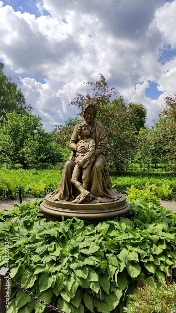 Sculpture in honor of the grandmother A.M. Hannibal and grandson of A.S. Pushkin surrounded by greenery 