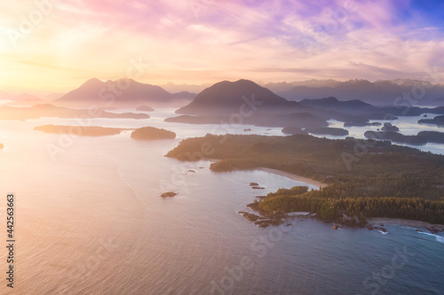 Aerial Canadian Landscape at the West Pacific Ocean Coast. Bright colorful vibrant sunset Art Render. Taken from Airplane in Tofino, Vancouver Island, British Columbia, Canada. © edb3_16