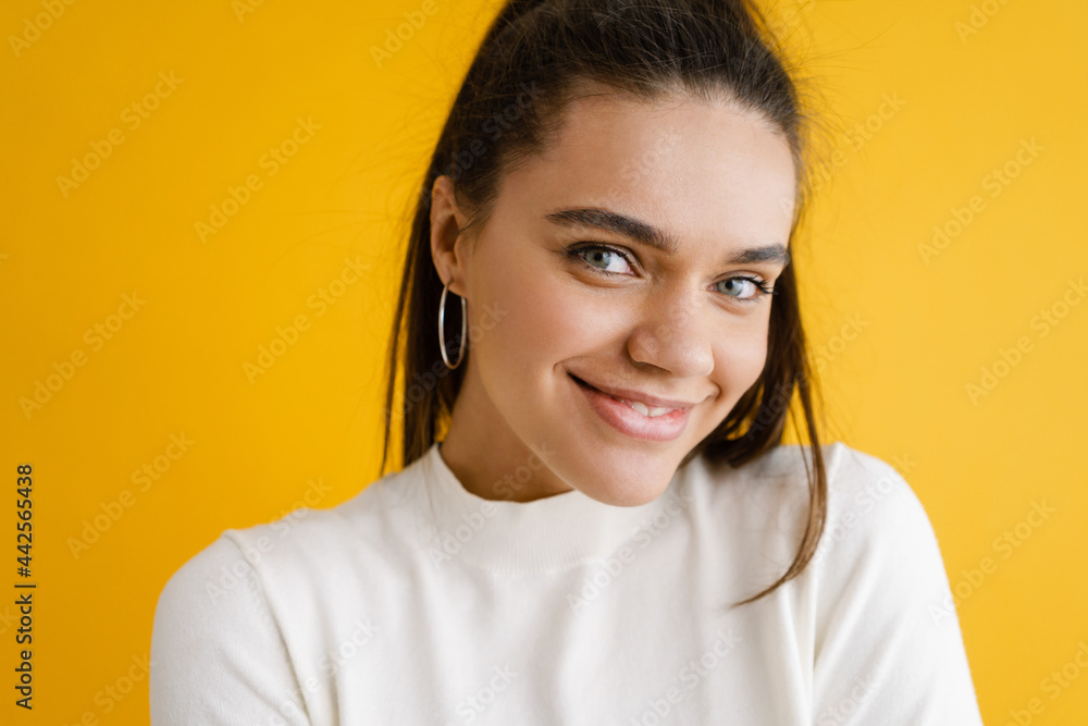 Young brunette woman smiling and looking at camera