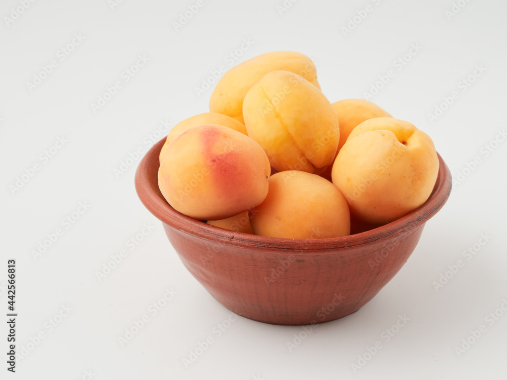 Apricot isolate. Apricots with slice on white. Fresh apricots. With clipping path. Full depth of field.