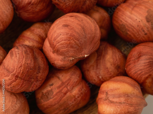 Close-up of hazelnut kernels on a white background, macro-detailed