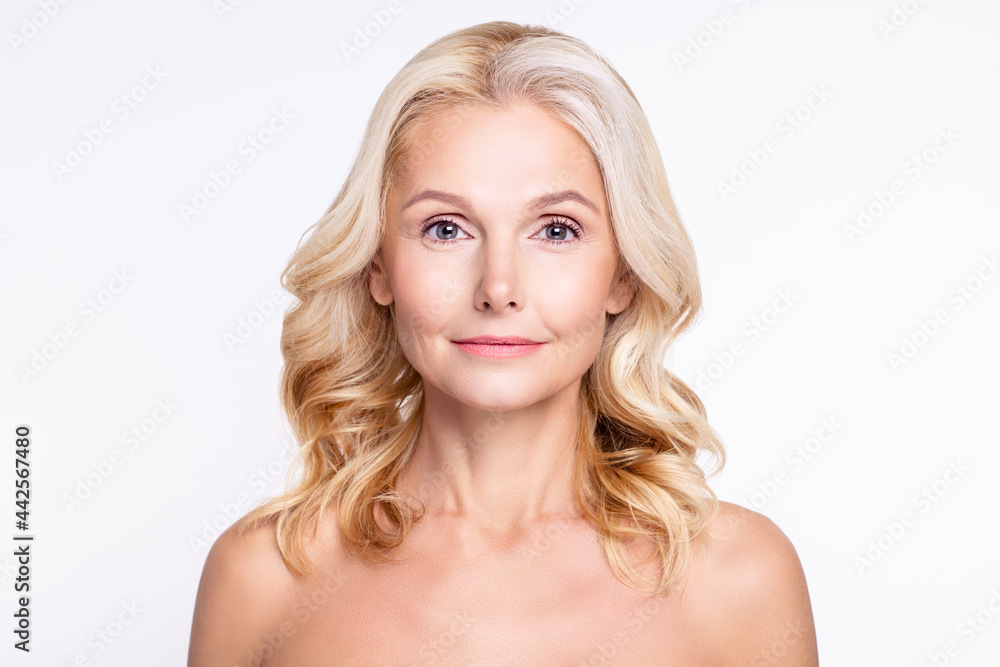 Portrait of attractive cheery calm grey-haired woman with smooth perfect skin laser peeling isolated over white color background Portrait of attractive cheery calm grey-haired woman with smooth perfect skin laser peeling isolated over white color background