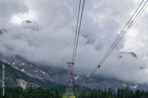 The steel support tower and the cable of the "Seilbahn Zugspitze" near Eibsee in Bavaria