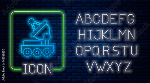 Glowing neon Mars rover icon isolated on brick wall background. Space rover. Moonwalker sign. Apparatus for studying planets surface. Neon light alphabet. Vector