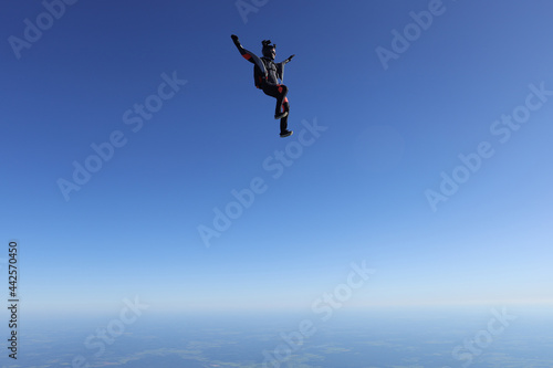 Skydiving. Solo girl is flying in the sky