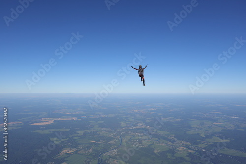 Skydiving. Solo girl is flying in the sky