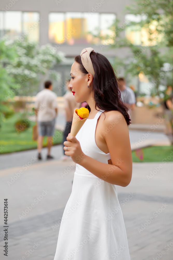 Happy Woman eating a delicious ice cream cone in vacation travel Happy Woman eating a delicious ice cream cone in vacation travel