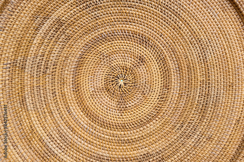 Naklejka premium Round wicker woven pattern texture or background