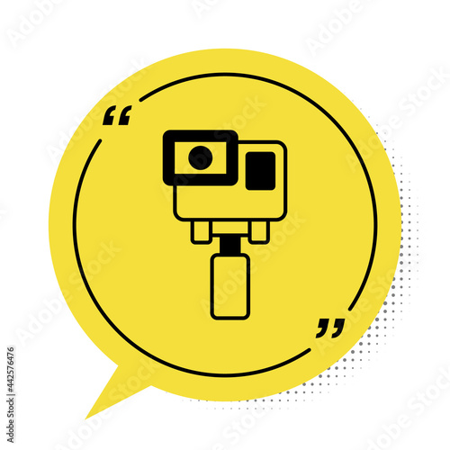 Black Action extreme camera icon isolated on white background. Video camera equipment for filming extreme sports. Yellow speech bubble symbol. Vector