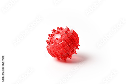 Barbed red massage ball isolated on white. Alternative medicine massage ball Sujok for acupressure procedures  photo