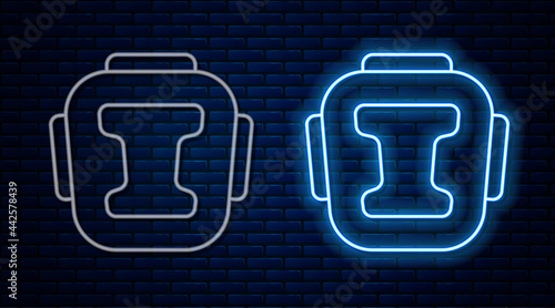 Glowing neon line Boxing helmet icon isolated on brick wall background. Vector