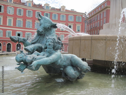 Scenic view of Fountain of the Sun . The main city square in Nice France is Place Massena. Famous marble statue of beautiful naked man body.