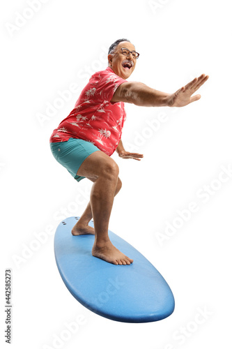Mature man riding a surfing board