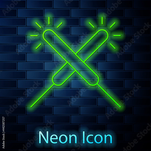 Glowing neon line Sparkler firework icon isolated on brick wall background. Festive Christmas sparkler candle lights. Merry Christmas and Happy New Year. Vector