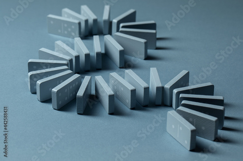Fotografie Light Blue wood domino pieces on light blue background