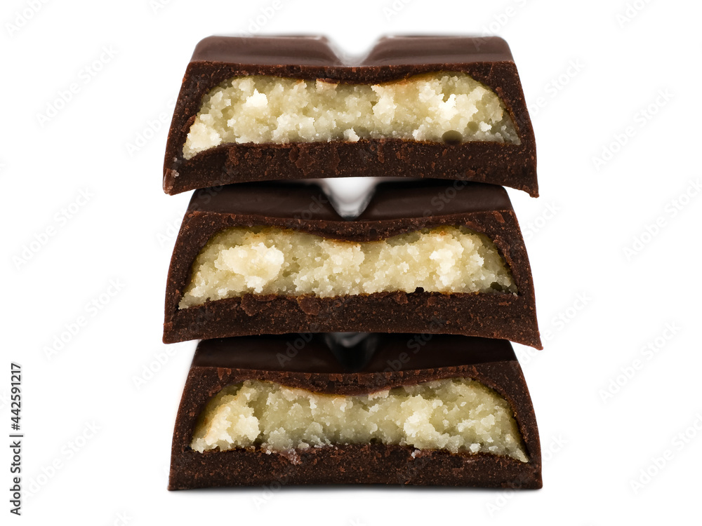 Stack of chocolate pieces with marzipan filling, close-up Stack of chocolate pieces with marzipan filling, close-up