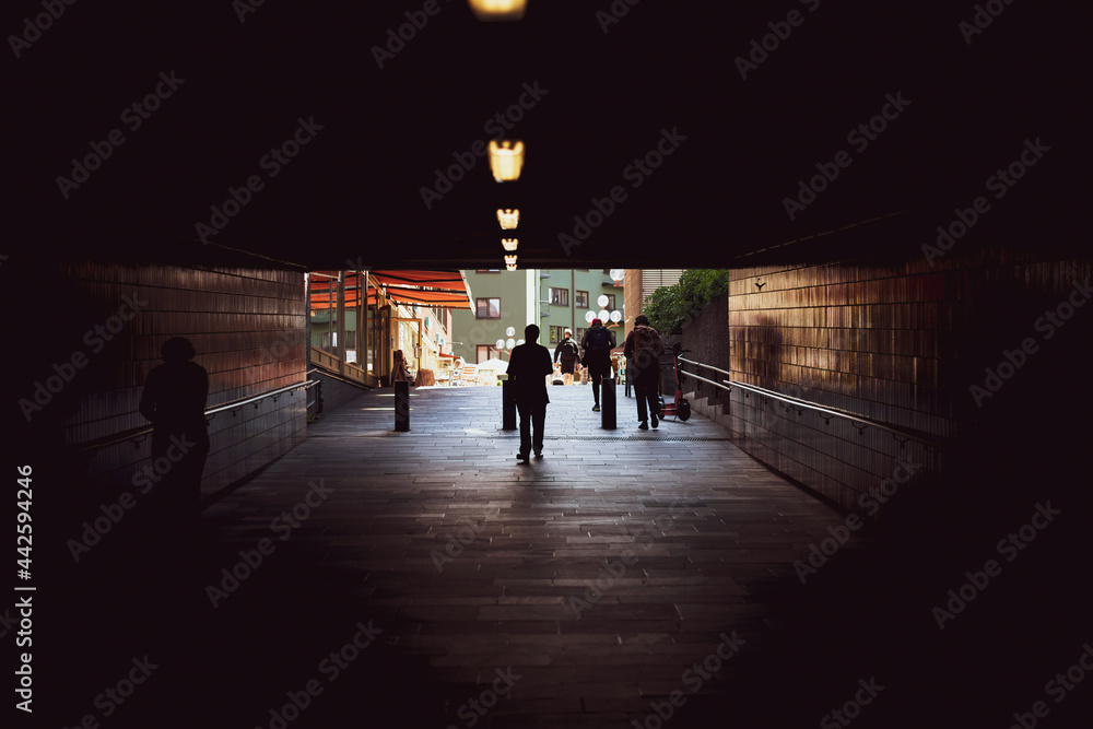 People coming out of the tunnel. Urban photography in Oslo.