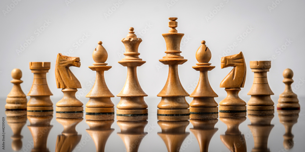 white chess pieces in a row white chess pieces in a row