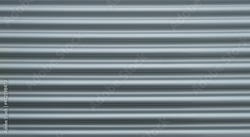 closeup of shiny new silver grey metallic blinds shutters