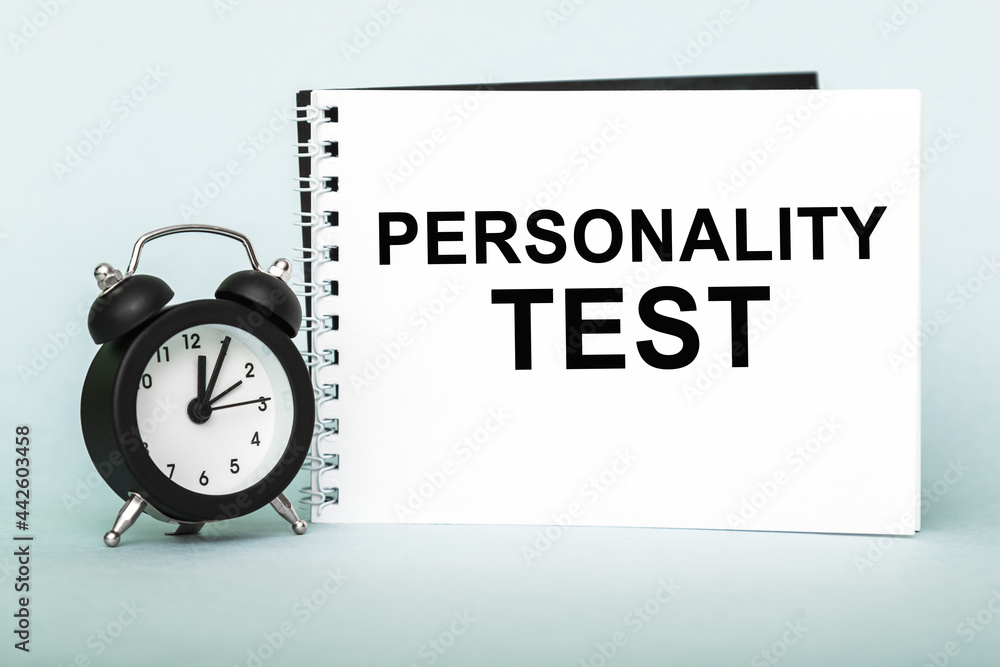 Personality test. Notebook with text , on blue background. Personality test. Notebook with text , on blue background.