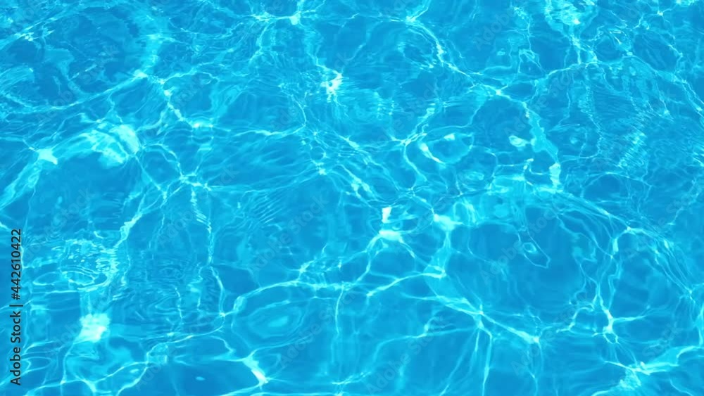 Pure transparent blue water in the swimming pool with light reflections. HD resolution video. Slow motion Texture of water in swim pool Pure transparent blue water in the swimming pool with light reflections. HD resolution video. Slow motion Texture of water in swim pool