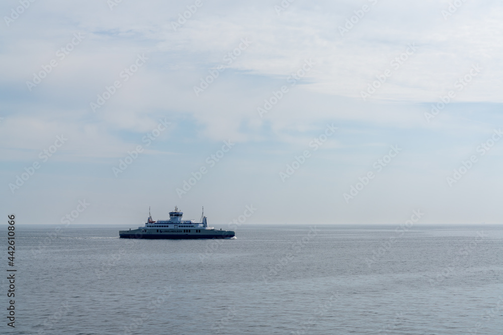 view of the Langeland Ferry crossing the open ocean from Langeland Island to Lolland Island in Denmark
