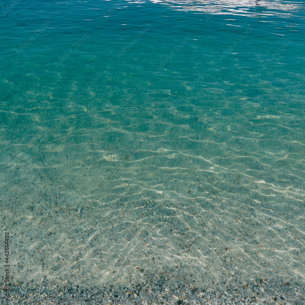 Fototapeta premium Natural background. Beautiful marine background. Seascape. Aerial top view of waves, foam, water, ocean. The nature of Adriatika