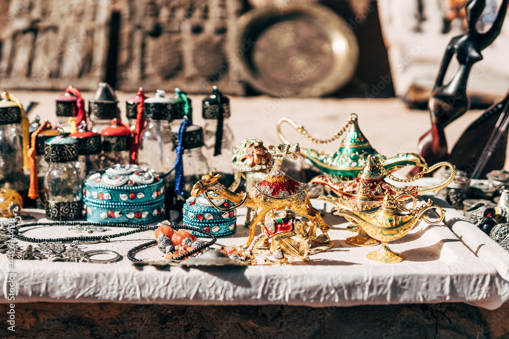Colorful traditional souvenirs on table at city street Colorful traditional souvenirs on table at city street