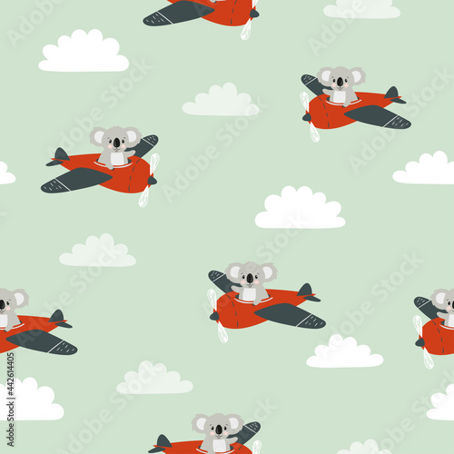 Seamless pattern with cute koala on plane. Baby print with cartoon pilots.