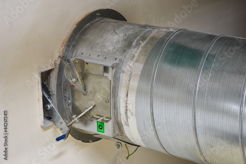 Large metal air duct and fire damper.
