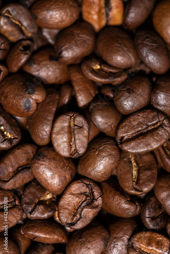 Fresh brown roasted coffee beans as a background