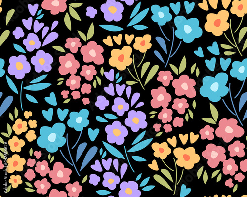 Seamless pattern with colorful small flowers and leaves