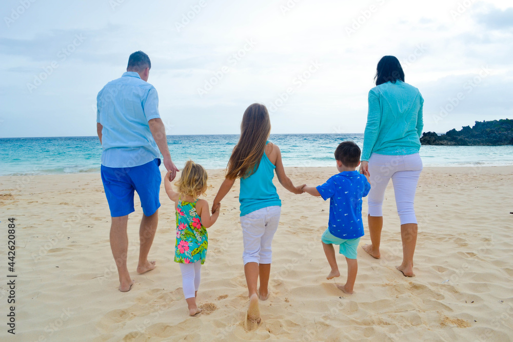 family walking on the beach