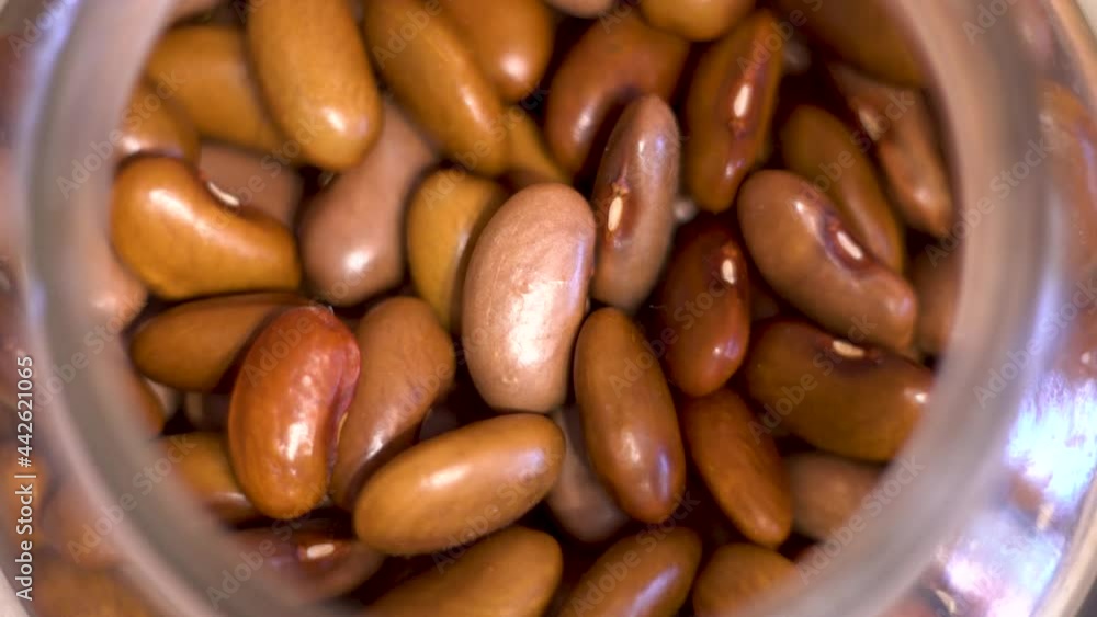 Dark beans. Peeled. View from above. Cooking ingredient. Healthy eating. Natural product. GMO. Genetically modified beans. Food. Vegetable protein. Image rotation. Dark beans. Peeled. View from above. Cooking ingredient. Healthy eating. Natural product. GMO. Genetically modified beans. Food. Vegetable protein. Image rotation.