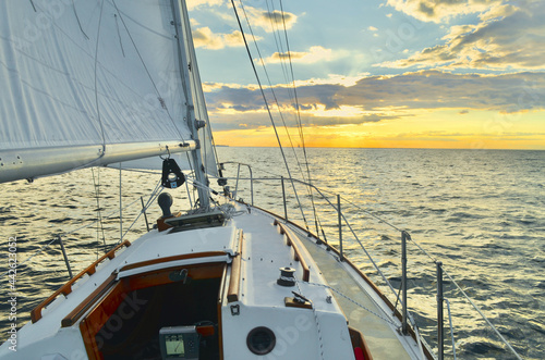 Fototapeta Naklejka Na Ścianę i Meble -  Sailing on a starboard tack looking west on the Long Island Sound.  Port Jefferson, New York.  Copy space.