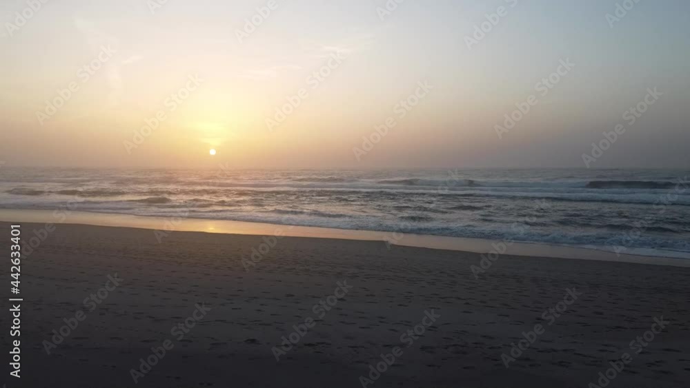 Sunset in a beach showing the calm in the golden hour and a little of waves on a still footage. Sunset in a beach showing the calm in the golden hour and a little of waves on a still footage.