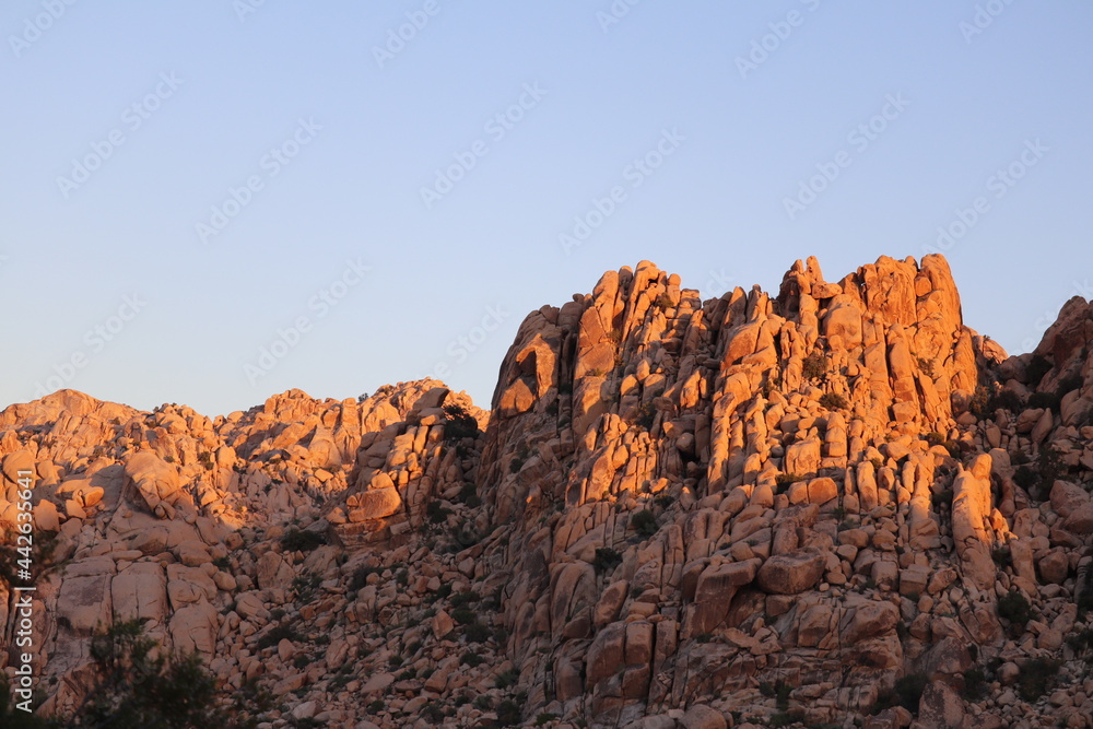 sunset over the mountains in desert Joshua tree national park