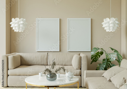 The living room is decorated with chairs  sofaand picture frames.