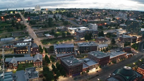 Cinematic 4K sunset evening night aerial drone pan footage of the St. Joseph Medical Center, University of Washington Tacoma, Tacoma old town, downtown waterfront, Glass Museum in Washington photo