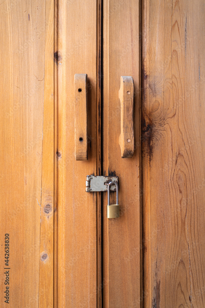 Double wooden door locked with a key Double wooden door locked with a key