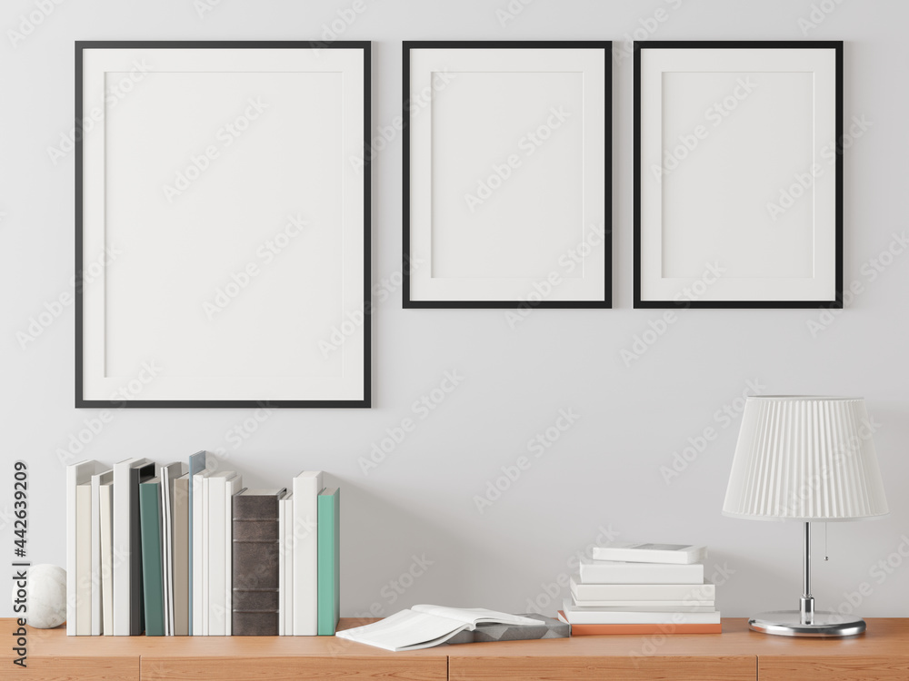 The working room is decorated with a table. Picture frame and lamp The working room is decorated with a table. Picture frame and lamp