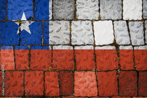 National flag of Chile on stone  wall background. Flag  banner on  stone texture background. © Виталий Сова