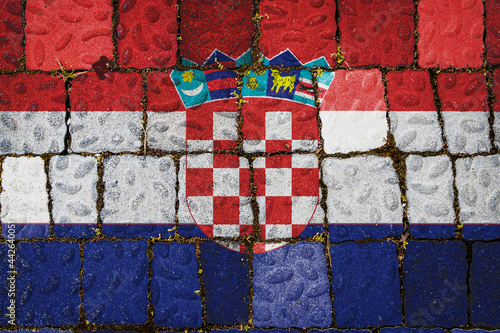 National flag of Croatia on stone wall background. Flag banner on stone texture background.