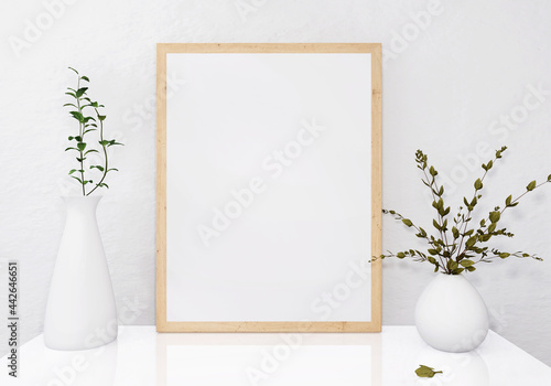 Picture frames with plant pots adorn the living room.