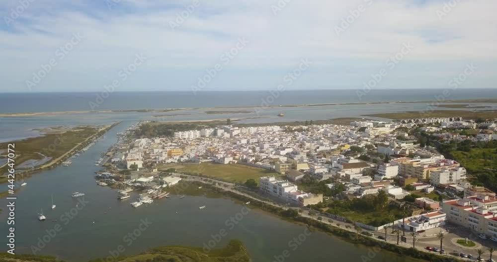 Aerial view over the small harbor and fishing village at Fuseta on the Algarve Portugal. Aerial view over the small harbor and fishing village at Fuseta on the Algarve Portugal.